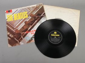 The Beatles Please Please Me vinyl LP record. Mono (PMC 1202) Fourth Pressing, matrix number XEX-