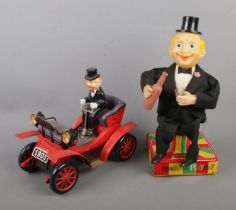 Two vintage Cragstan battery operated tinplate toys to include Old-Timer Car and Playboy Bartender.