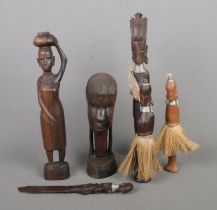 A collection of carved African items to include letter opener featuring kneeling figure to handle.