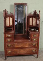 A late nineteenth/early twentieth century walnut dressing table, raised on casters and with turned