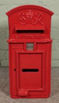 A George VI cast iron hanging postbox, with arched top and makers W.T. Allen and Co. London to the