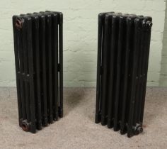 Two painted six-bar cast iron radiators. Height: 75cm.