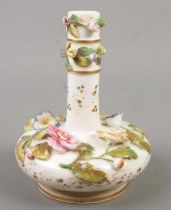 A Rockingham porcelain scent bottle. Decorated with applied Dresden flowers and gilt bands. Baring