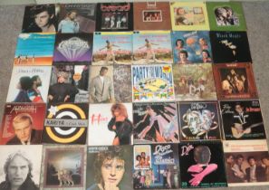 A carry case of LP records. Includes Commodores, Rod Stewart, Paul Young, etc.