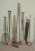 A collection of vintage tools including drain spade/trenching spade, spirit level, spike maul etc