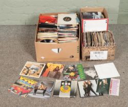 Three boxes of assorted vinyl singles of mainly pop and easy listening to include ABBA, Madonna, Tom