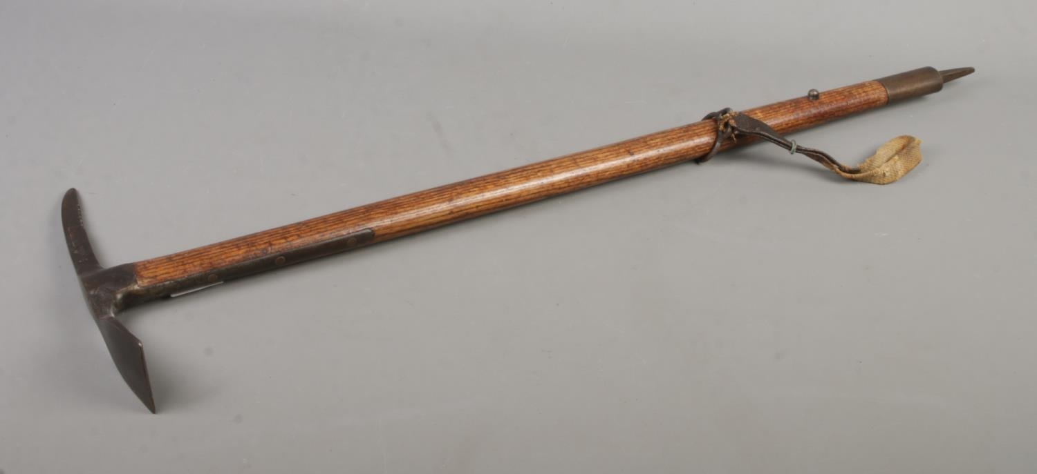 A second world war British military pickaxe with steel head produced by Cornelius Whitehouse LTD