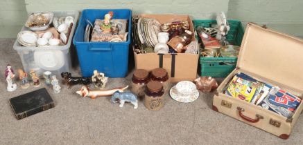 Four boxes of miscellaneous. Includes ceramic figures, cabinet plates, suitcase of linen, metal