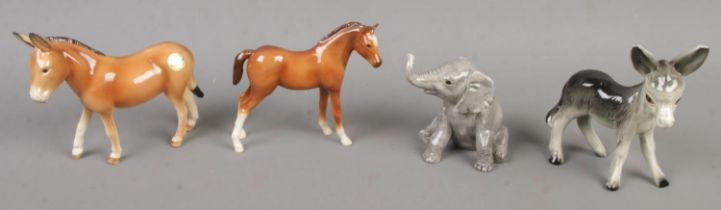 Three boxed John Beswick figures along with a similar example. Includes Donkey, Elephant, etc.