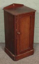 A Victorian mahogany pot cupboard.