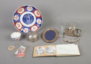 A collection of miscellaneous to include vintage autograph book, silver plated photo frame,