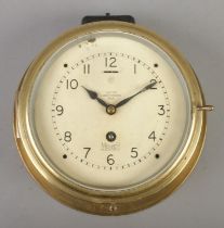 A Mercer (St. Albans, England) 'Octo' brass bulkhead clock. With serial number to surround A.P W6578