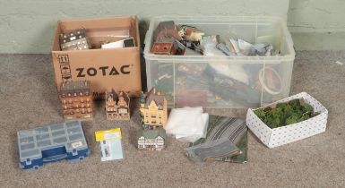 Two boxes of assorted model railway scenery, buildings and diorama supplies. Includes foliage,