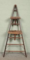 A wooden 'A Frame' seven rung ladder, possibly for fruit picking. With two additional platforms.