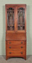 An oak bureau bookcase with leaded and stained glass top. 206 x 80 x 39cm