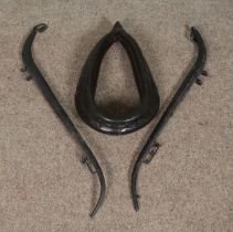 A small leather horse collar along with a pair of iron horse hames.