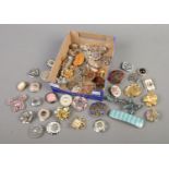 A tray of costume jewellery brooches, hair clips and scarf clips.