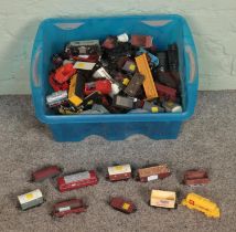 A box of assorted model railway stock of mostly OO Gauge to include carriages, wagons and tankers.
