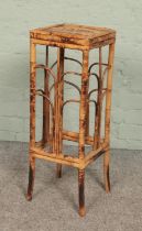 A bamboo plant stand. Height 72cm.