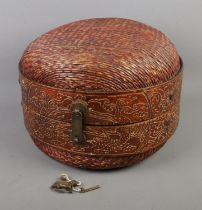 A Chinese round woven wedding basket featuring central band decorated with dragon motifs. With