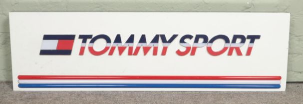 A shop advertising lighting sign for 'Tommy Sport'; Tommy Hilfiger. 121cm long. In working order.