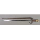 A French 1874 bayonet with scabbard. Inscribed to edge of blade and dated 1878. Blade length 52cm.