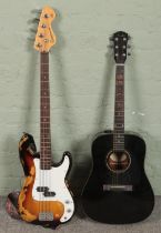 A Fender acoustic guitar (DG-5BLK) along Encore bass guitar Blaster Series. Damage to side of the