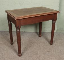 An early 20th century oak table/desk.