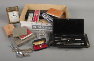 A box of mixed collectibles including cigarette cases, silver cut glass dish, architectural
