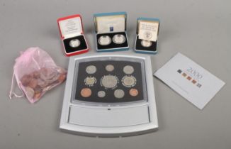 A collection of cased silver proof coin sets to include one pound coin, 1992 ten pence two-coin