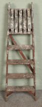 A set of wooden decorators ladders.