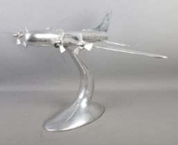 A large chromed model of a four engine plane. 40cm high.