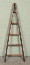 A small wooden 'A Frame' five rung ladder, possibly for fruit picking. Height 136cm.