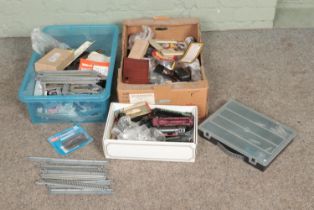 Two boxes of model railway spares and repairs to include motors, cable, track, etc.
