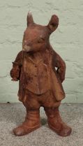 A rusted cast iron garden ornament of Ratty, from Wind in the Willows. 45cm high.