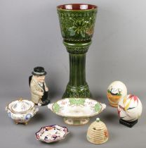 A quantity of ceramics. Includes Royal Doulton Winston Churchill character jug, painted ostrich egg,