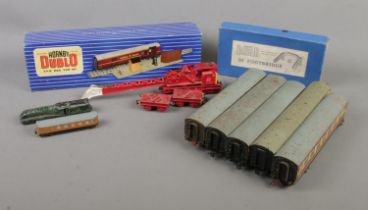 A quantity of mostly Hornby Dublo. Includes crane, boxed T.P.O Mail Van Set, carriages, boxed D1