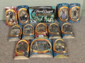 A collection of Toy Biz Lord of the Rings action figures along with a boxed Trivial Pursuit: Lord of