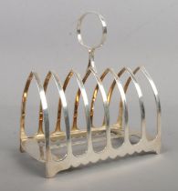 A George V seven bar silver toast rack. Assayed for Sheffield, 1921 by James Dixon and Sons. Total