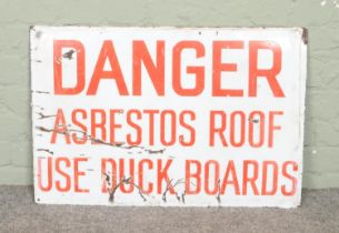 A vintage enamelled sign. 'Danger Asbestos Roof'. 51cm x 76cm.