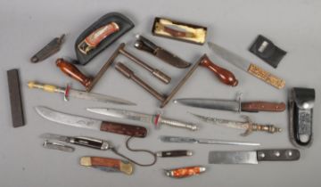 A box of mostly knives and daggers. Includes Will Rodgers, Venture H.M.Slater, winding handles,