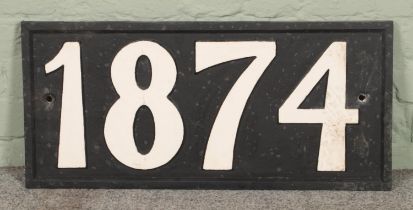 A large cast iron year sign with year 1874. 71x33cm.