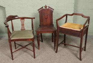 Three antique mahogany chairs. Includes two Edwardian inlaid examples and a Victorian hall chair.