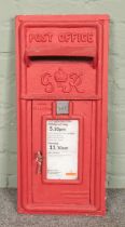 A red painted George VI post box front. Makers mark for Carron Company, Stirlingshire.