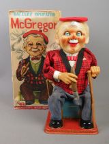 A boxed Rosko toys battery operated tinplate McGregor.