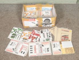 A large box of Alphagraphix precision card kits 1/43 scale.