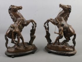 A pair of spelter Marley Horses, 42cm tall. Stamped 'Made in England to the bases. Some of the outer