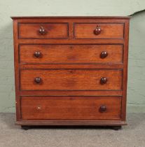 An oak two over three chest of drawers. Back leg missing. One handle loose. Badly damaged to