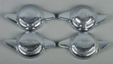 Four chrome Jaguar knock on/off wheel hub caps. One example split to centre.