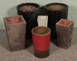 A quantity plant pots, including two Apta examples; 45cm tall.